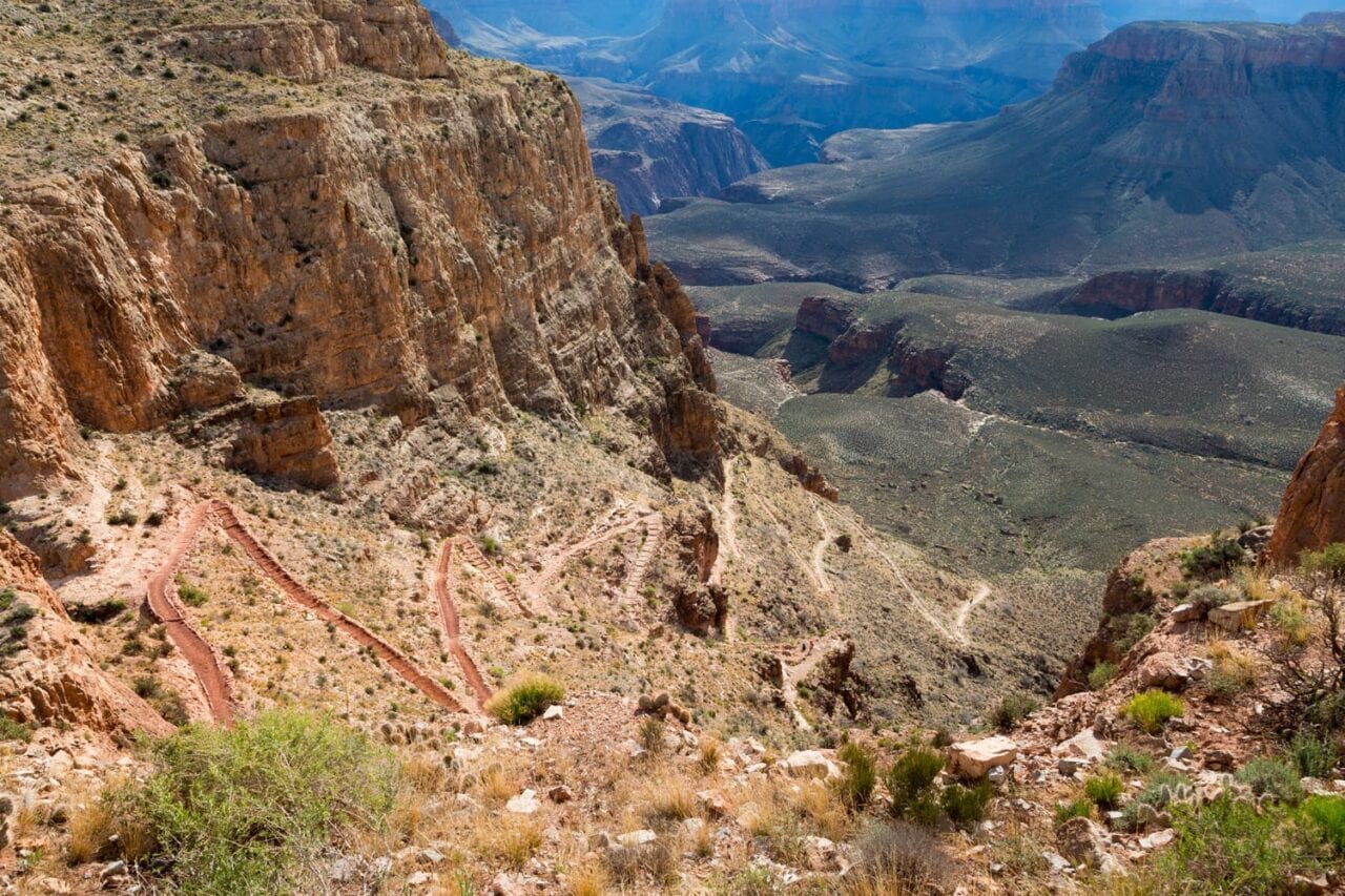 A series of steep switchbacks descends along the South Kaibab Trail toward the Vishnu Basement Rocks in the Grand Canyon.