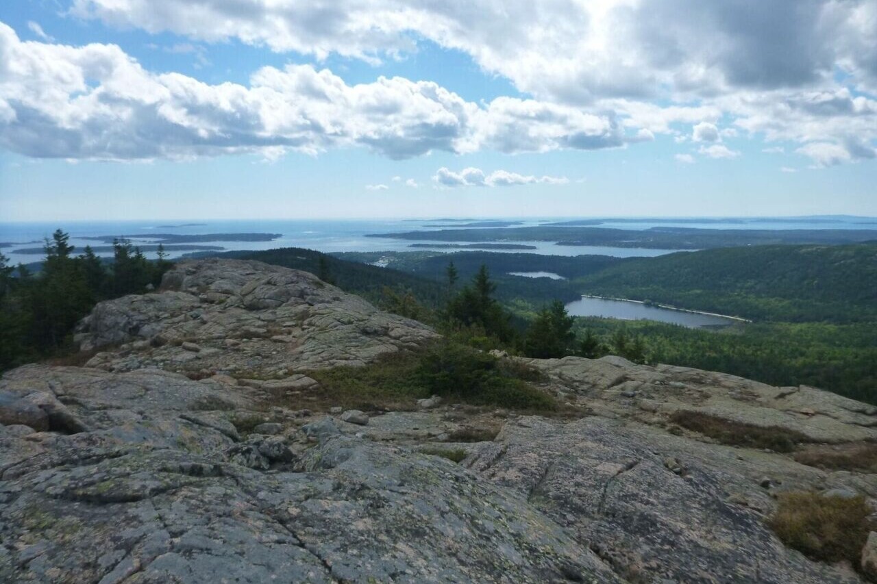 A rocky ridge overlooks a lake.