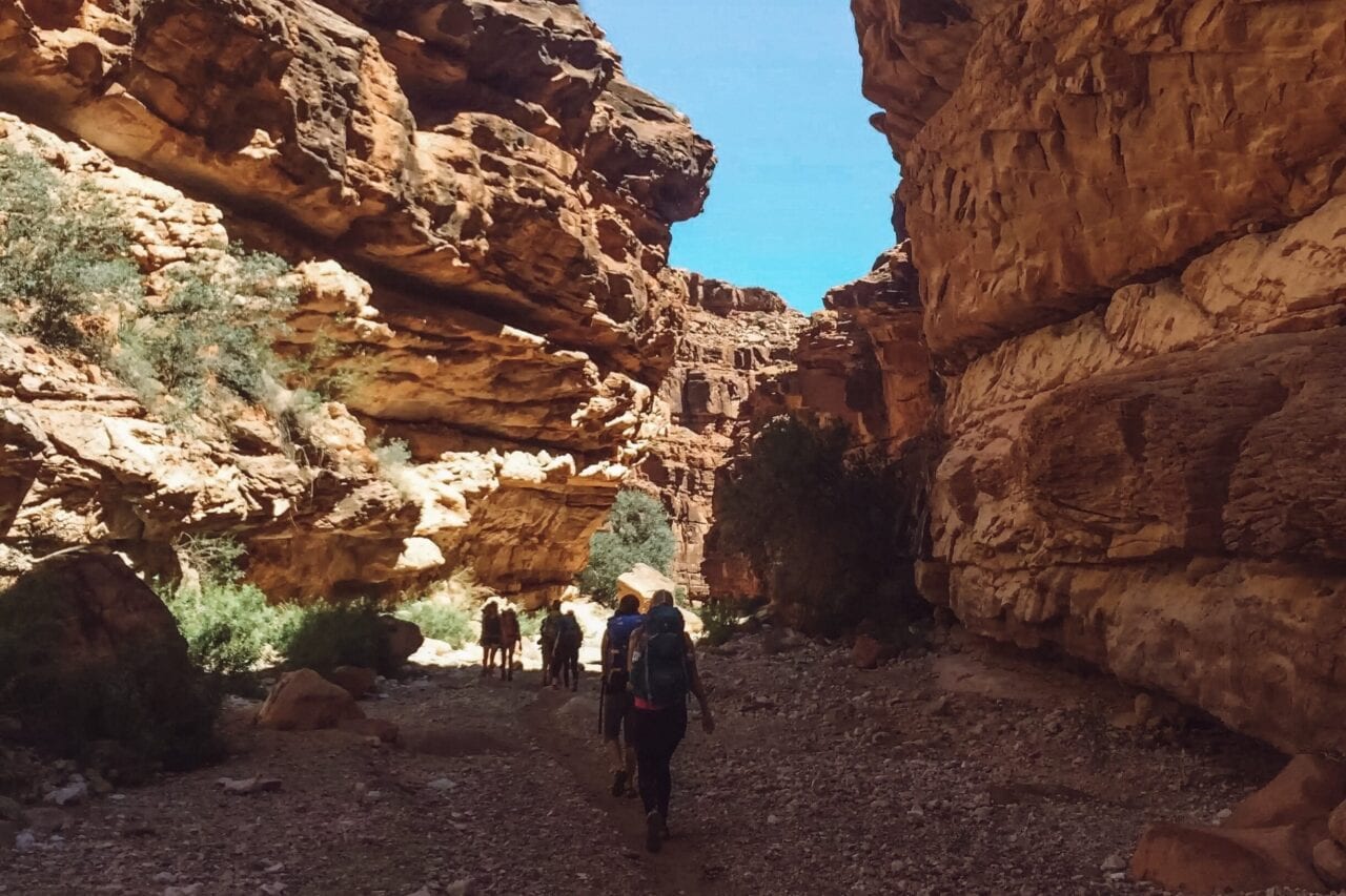 Hiking to Havasupai Falls through a canyon.