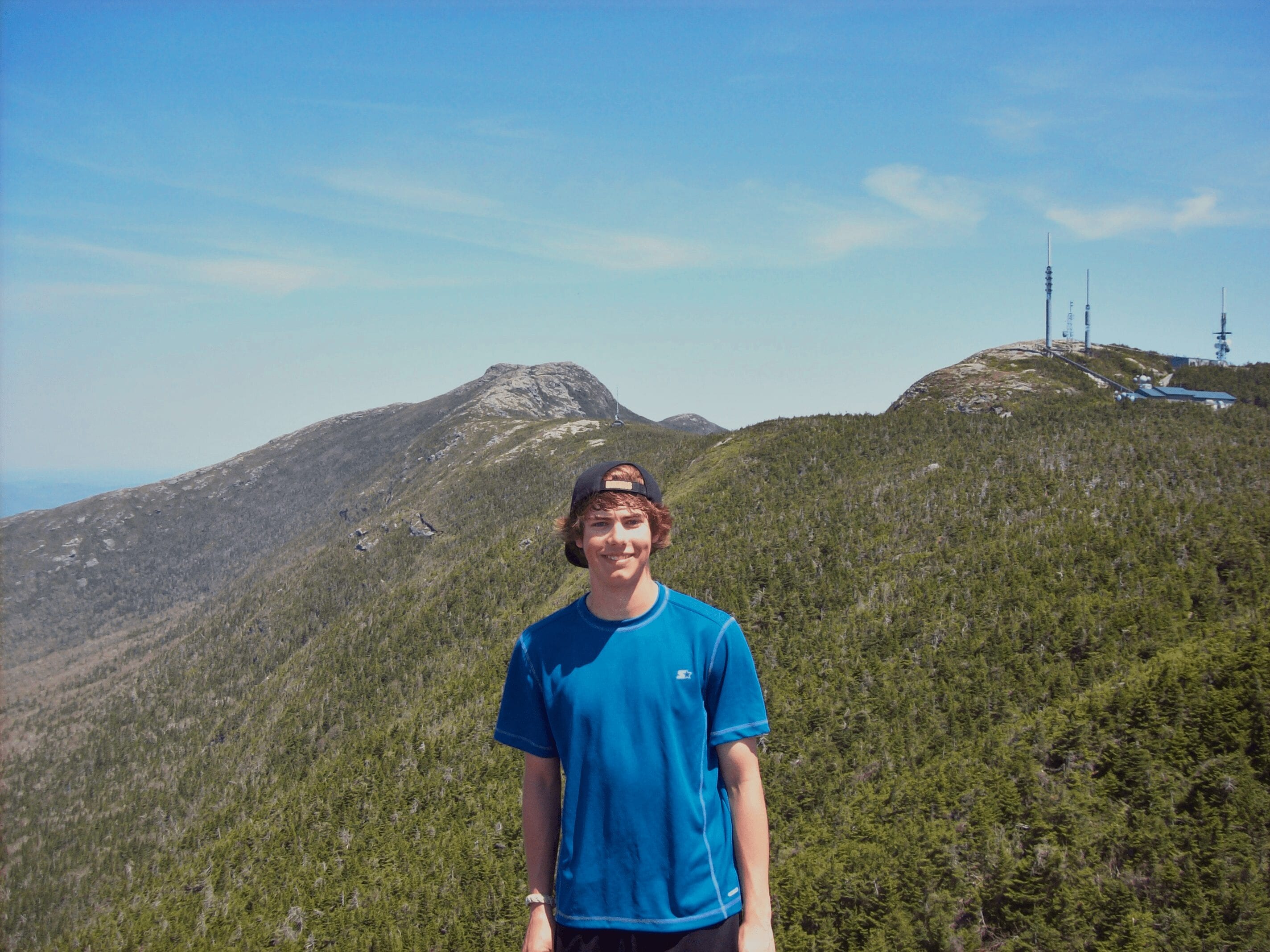 A teenage boy hiking.