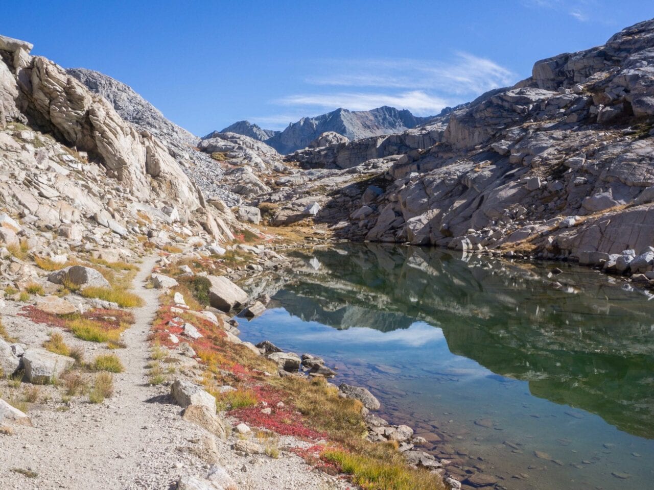 A beautiful landscape photo of mountains and a small lake.