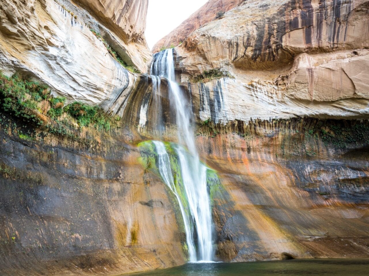 A waterfall flowing off a rock formation.