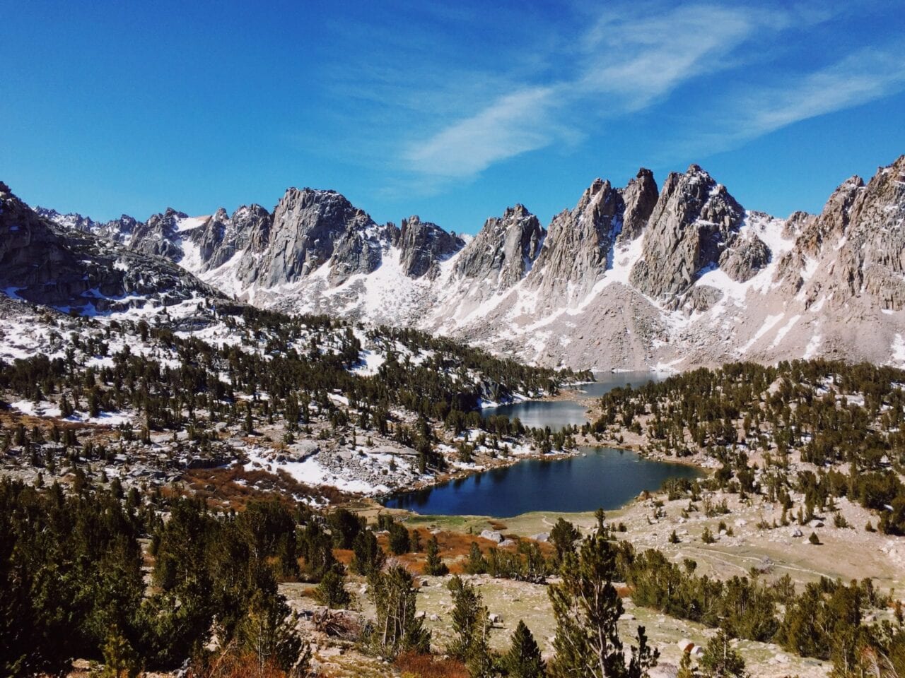 A beautiful view of mountains with a lake in the distance.