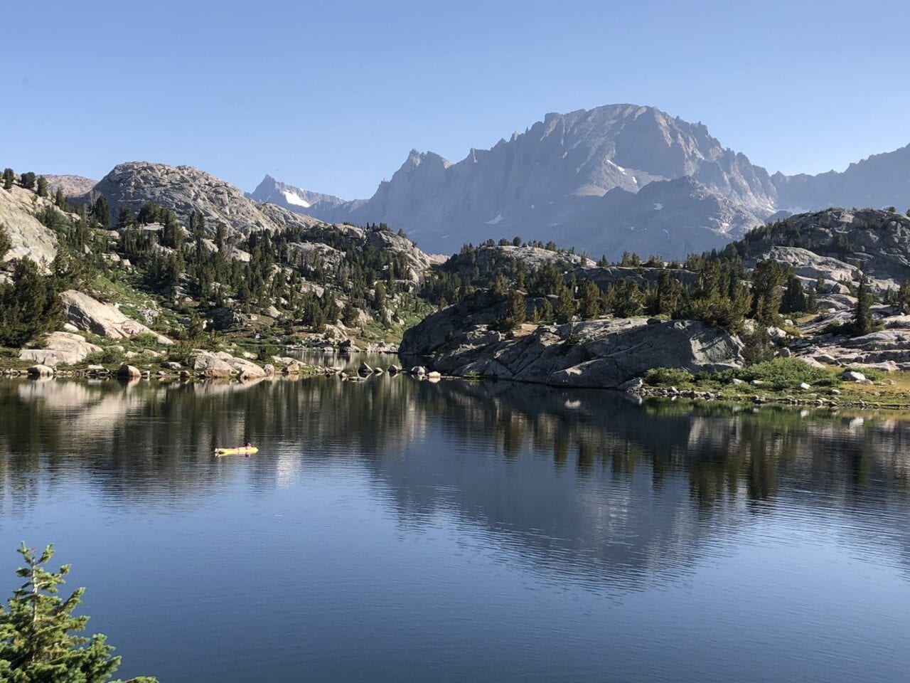 A lake with mountains around it.