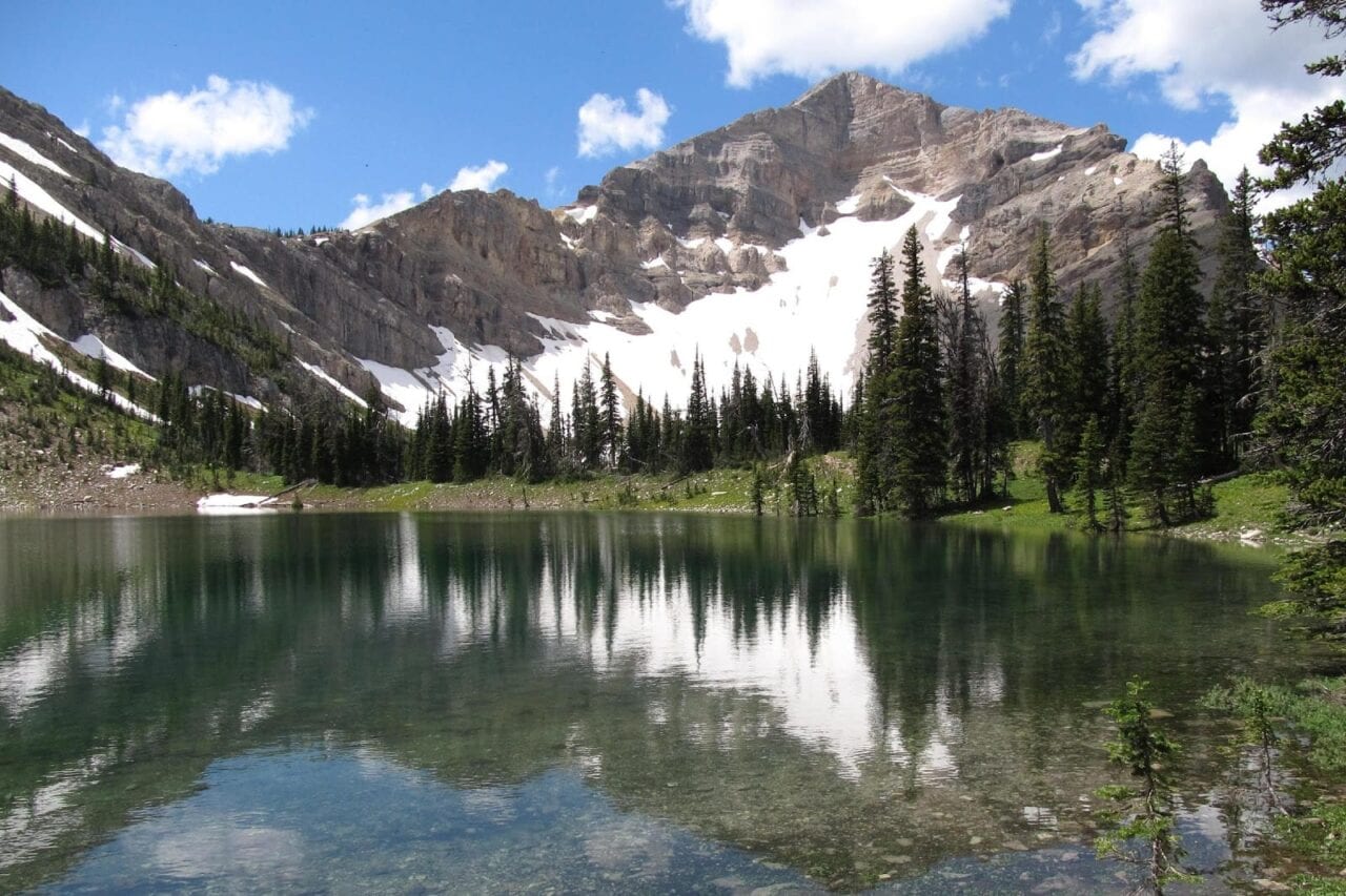 A beautiful lake with a mountain covered in snow.