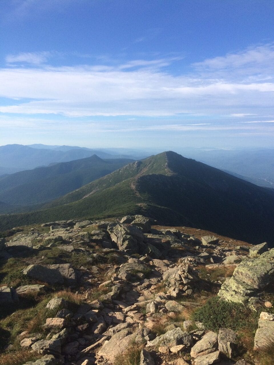 A mountain covered in green vegetation.