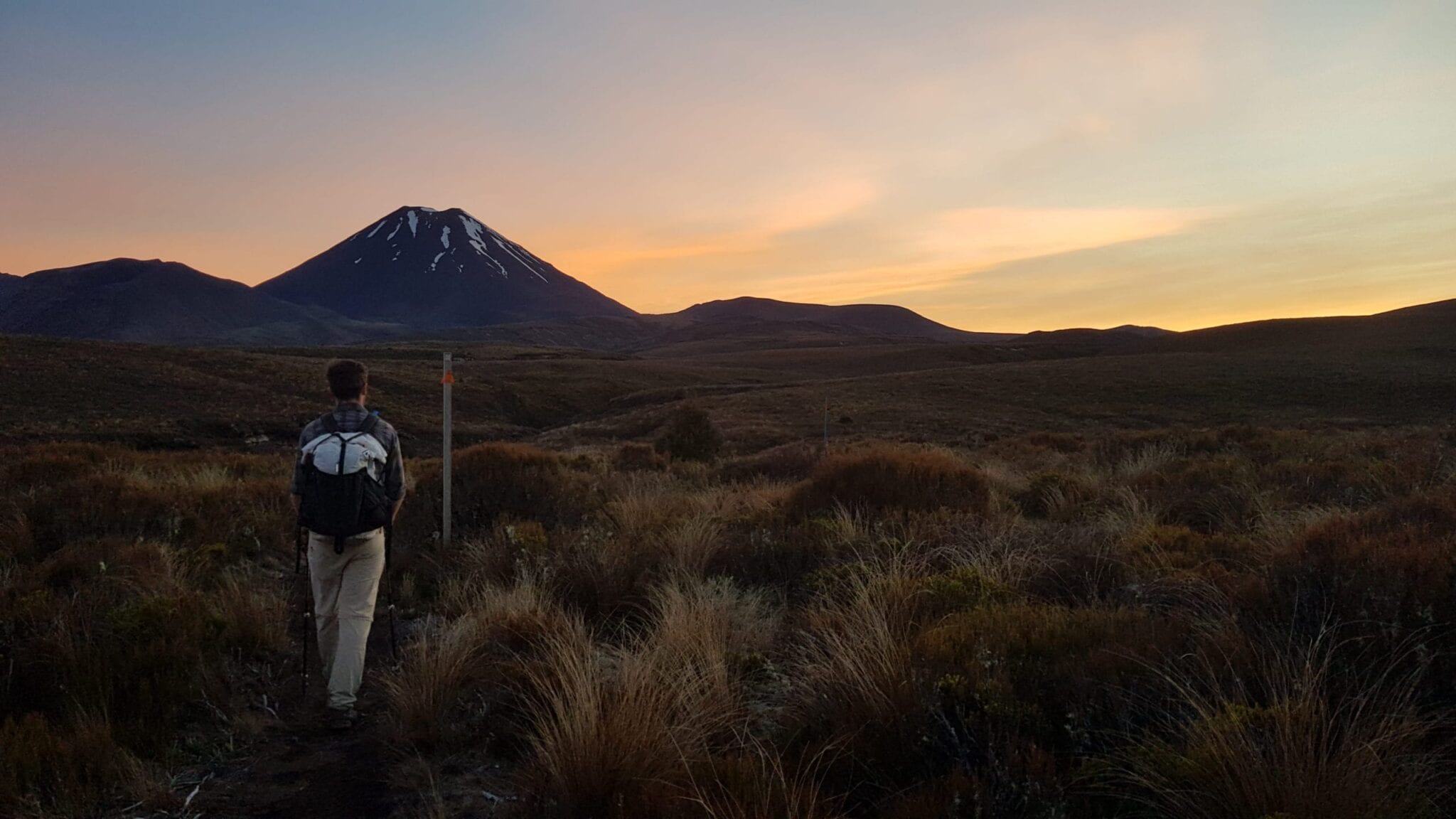 A man hiking the Te Araroa at sunset.