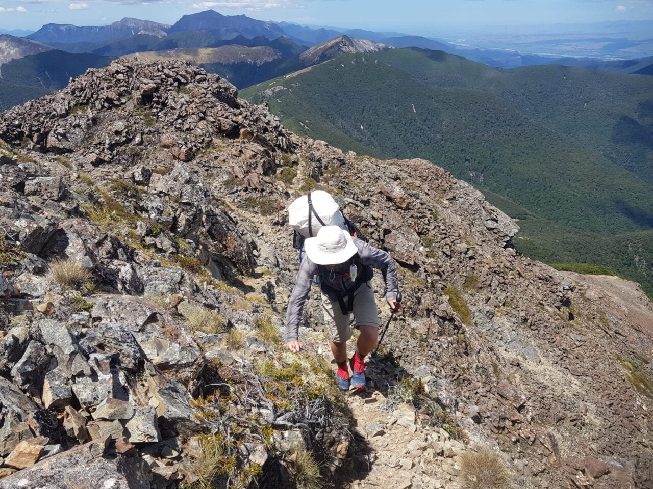 A hiker on a rocky mountain on the Te Araroa.