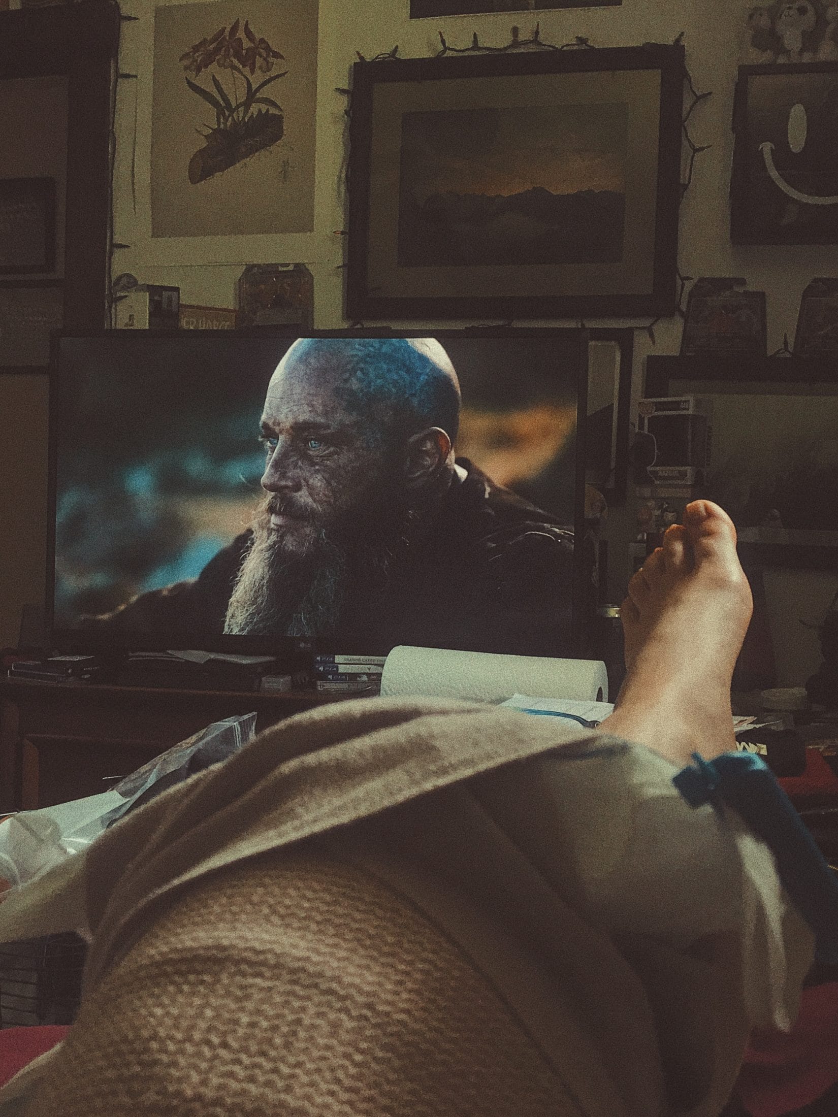 A injured knee wrapped in medical tape.