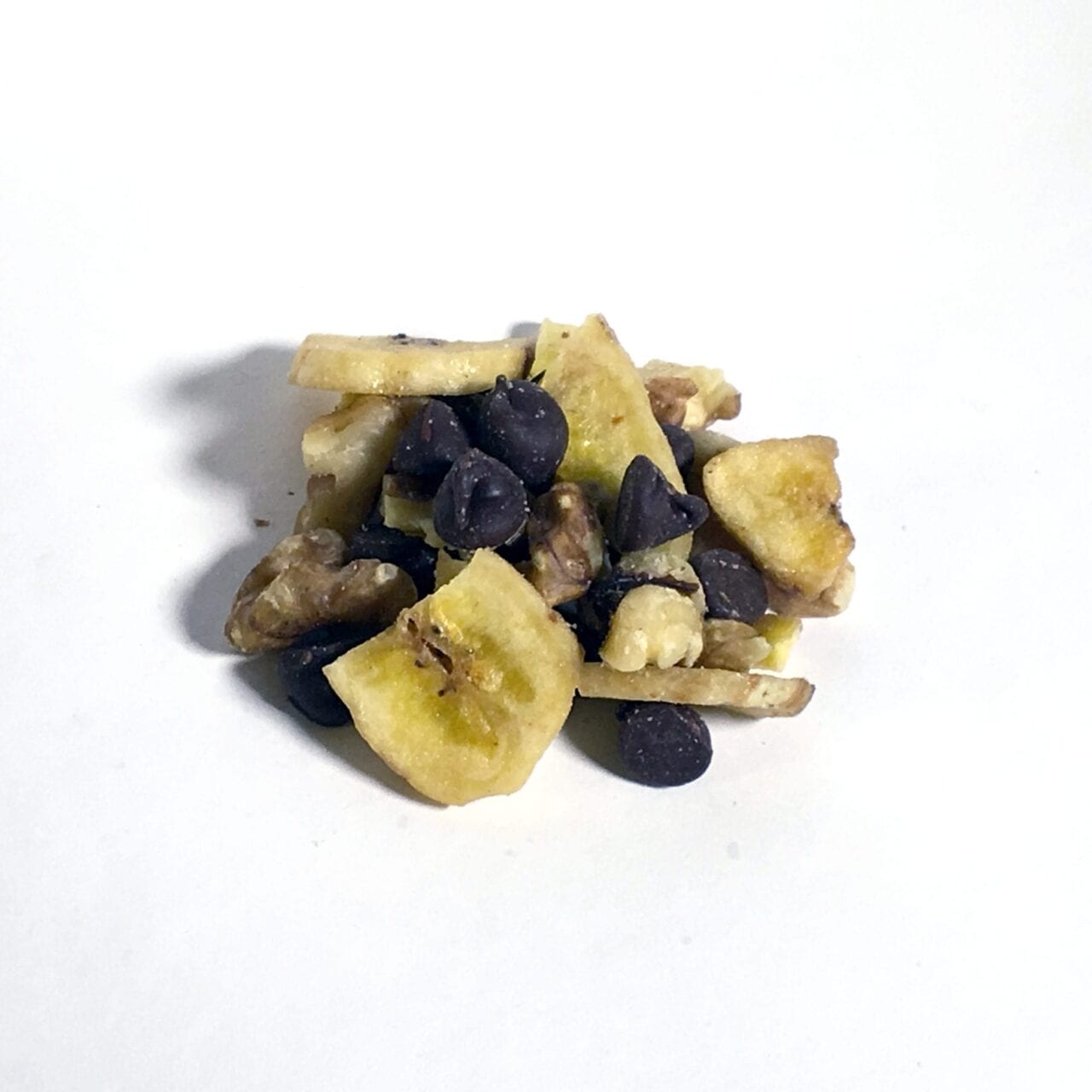 A pile of GORP trail mix including chocolate and fruit.