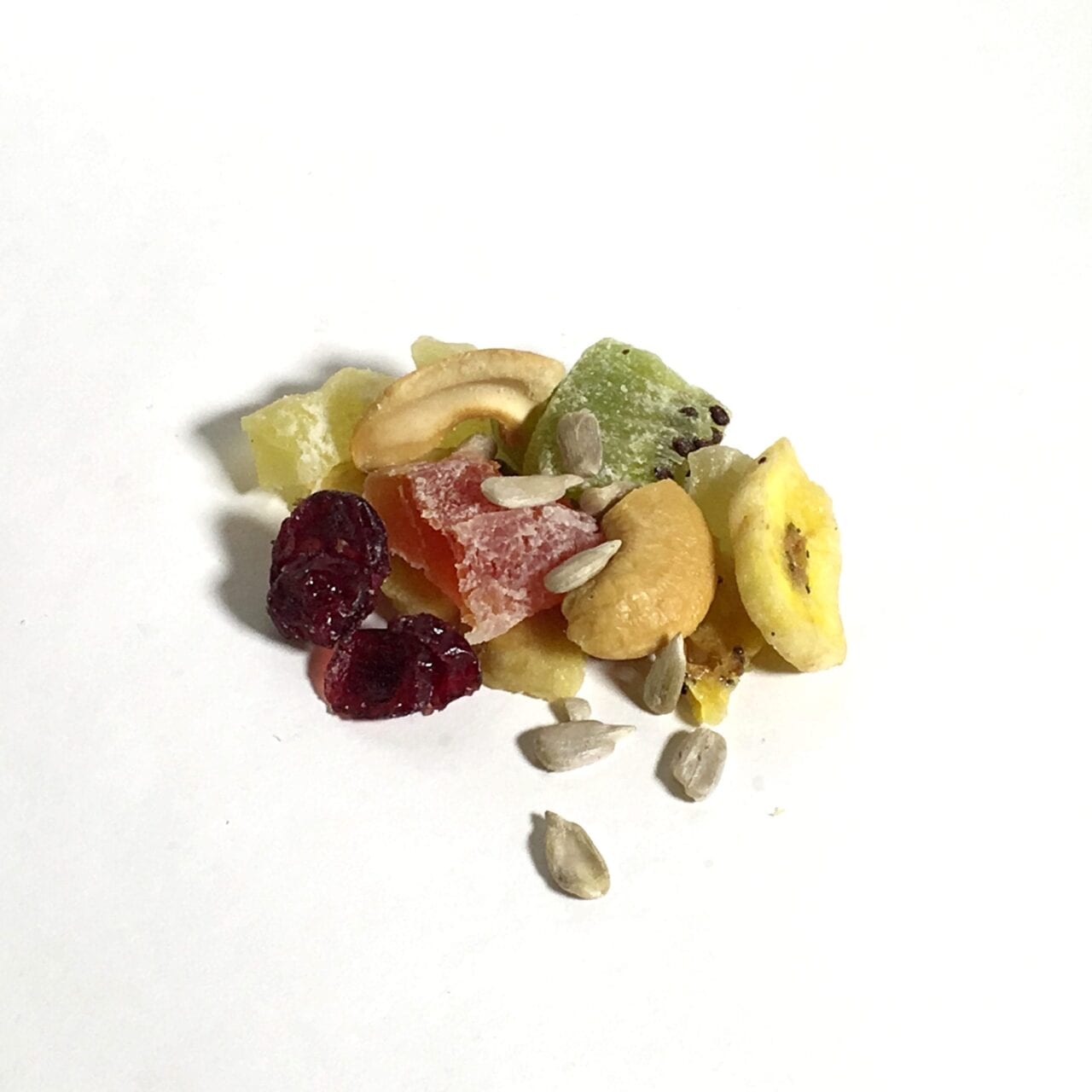 A pile of GORP trail mix including sunflower seeds and fruit.