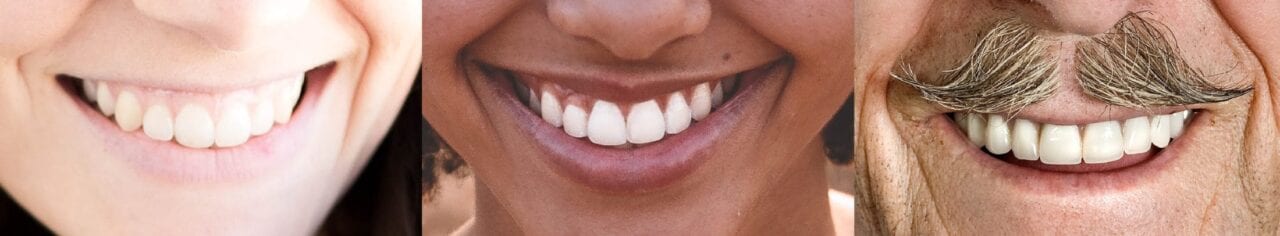 Three people smiling.