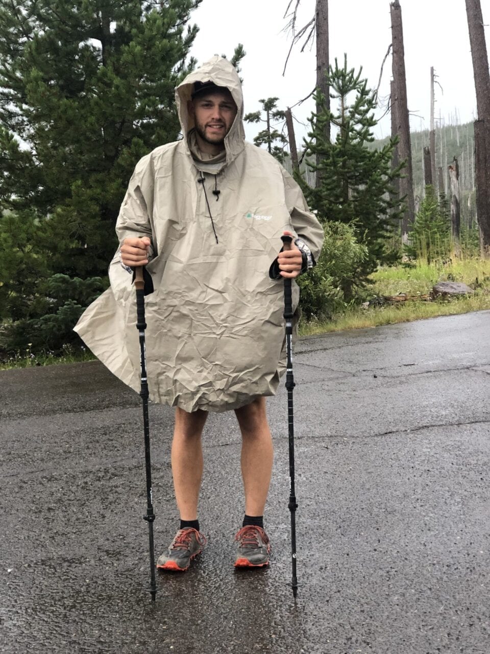 A thru-hiker in a rain poncho.