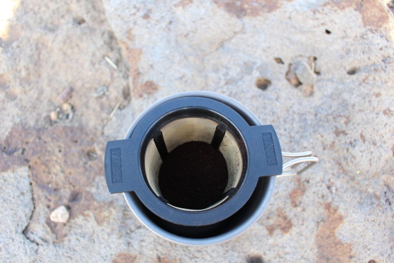 Coffee filter in a camping coffee mug.