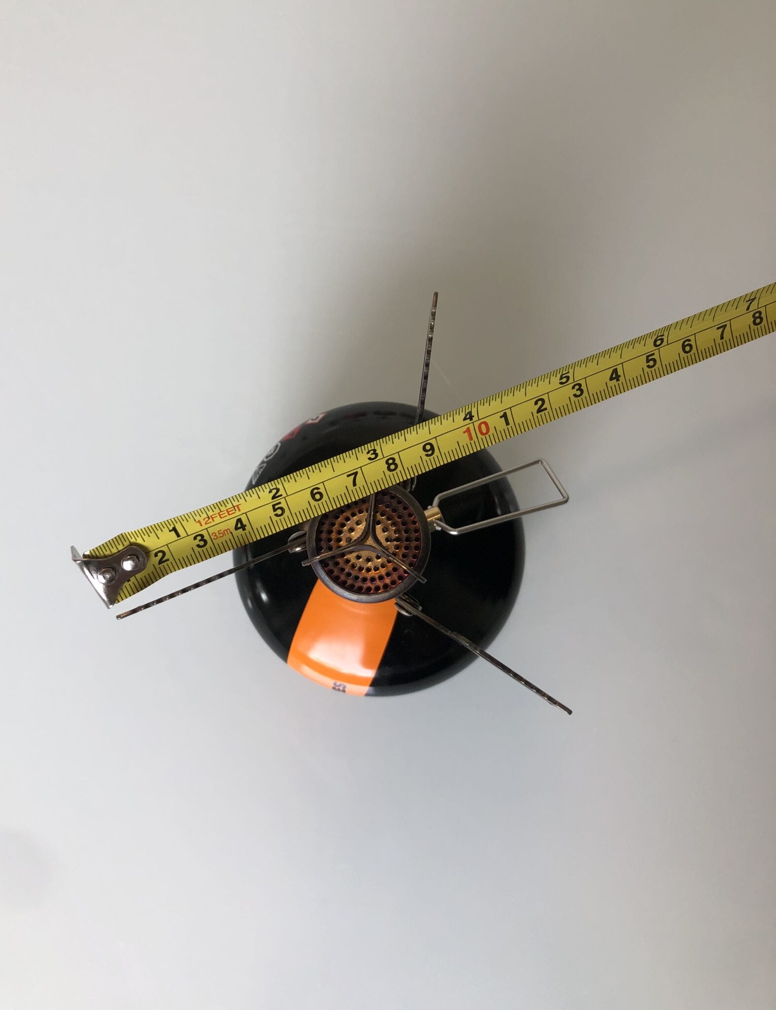 The MSR PocketRocket 2 attached to a fuel canister next to a ruler.