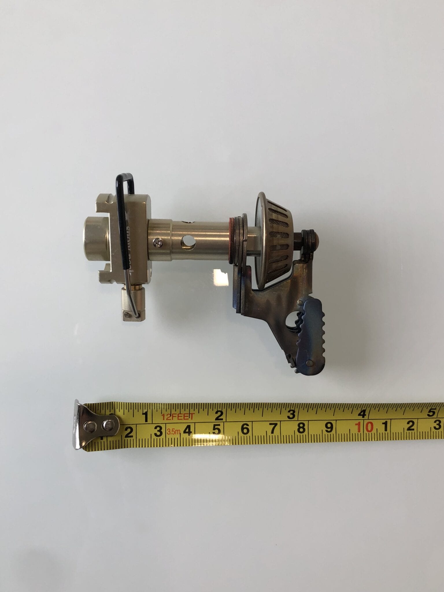 The Snow Peak LiteMax stove measured next to a ruler.