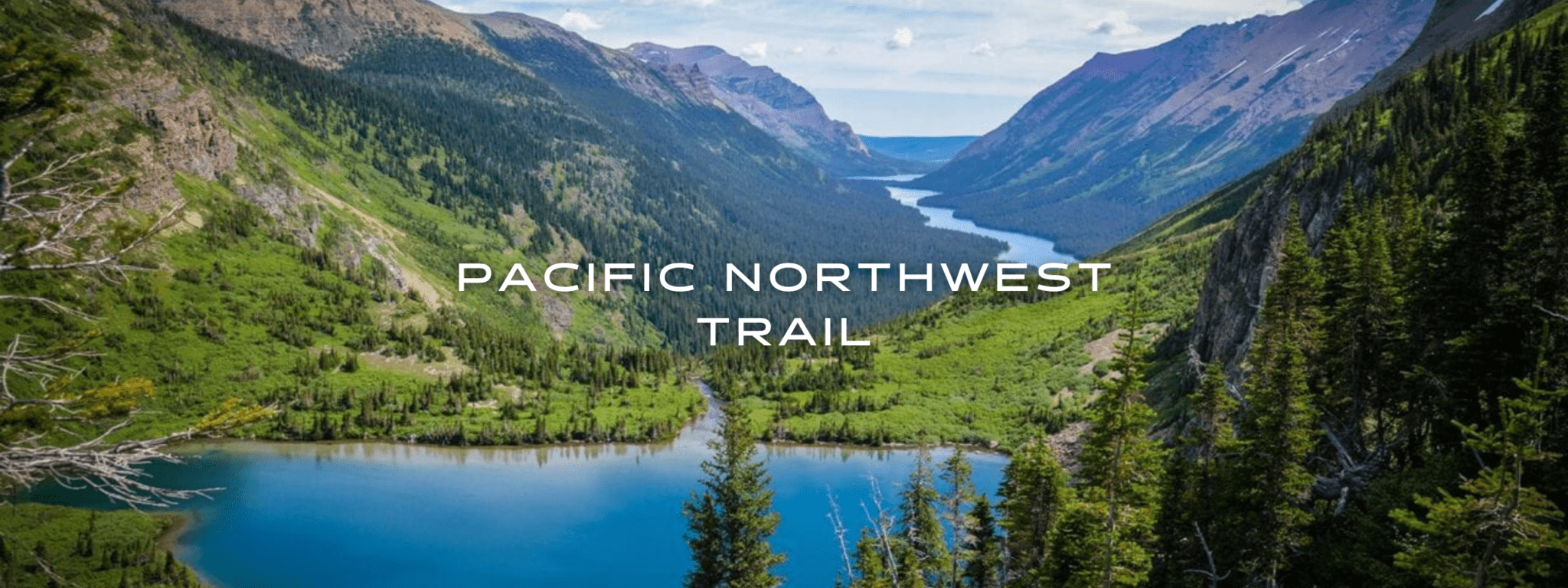 Glenn's Lake sits in a beautiful green valley between majestic peaks in Glacier National Park on the Pacific Northwest Trail.