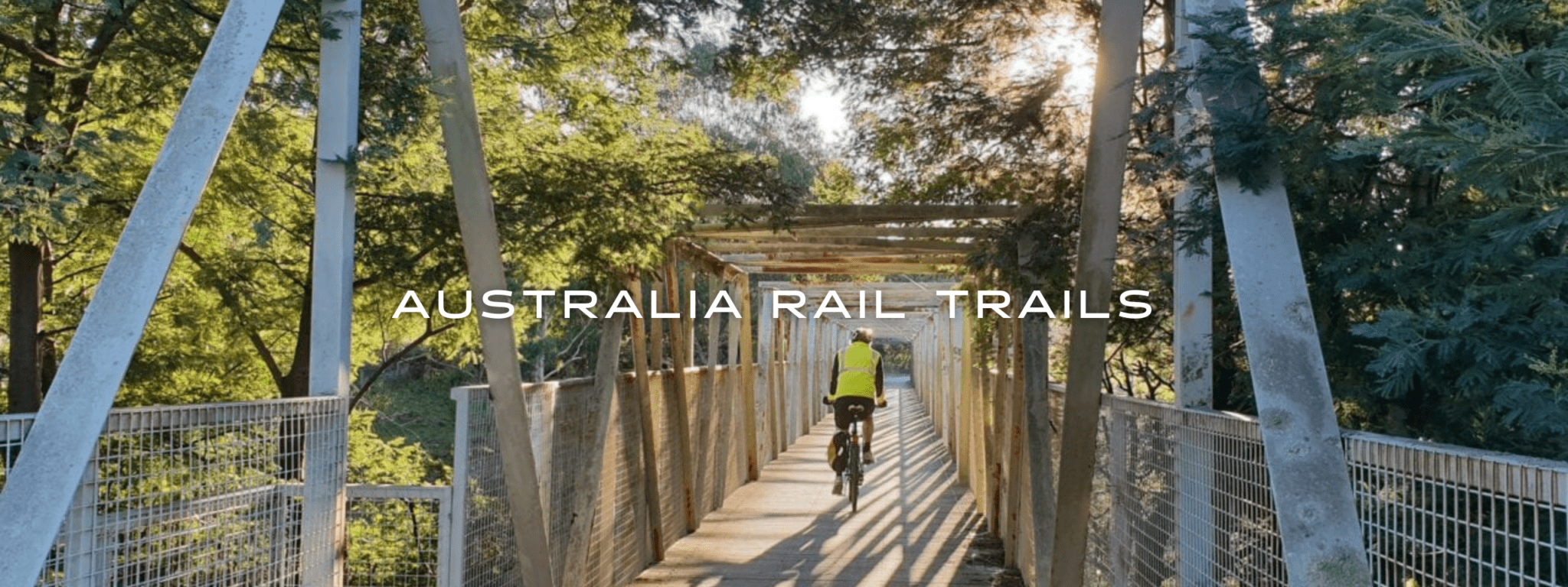 A person biking on the Meeniyan Bridge on the Great Southern Rail Trail Victoria.