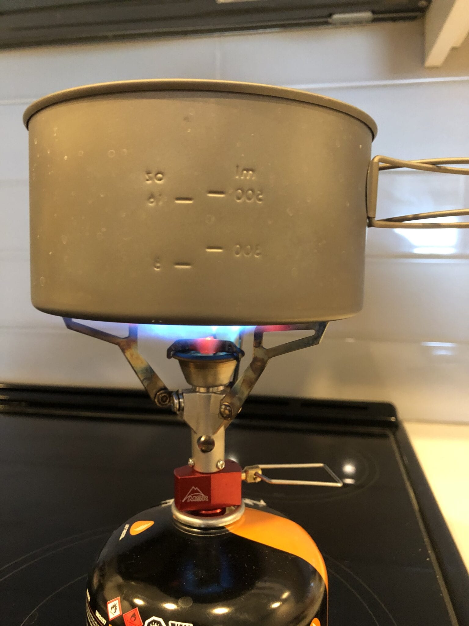 backpacking stove boiling water in pot