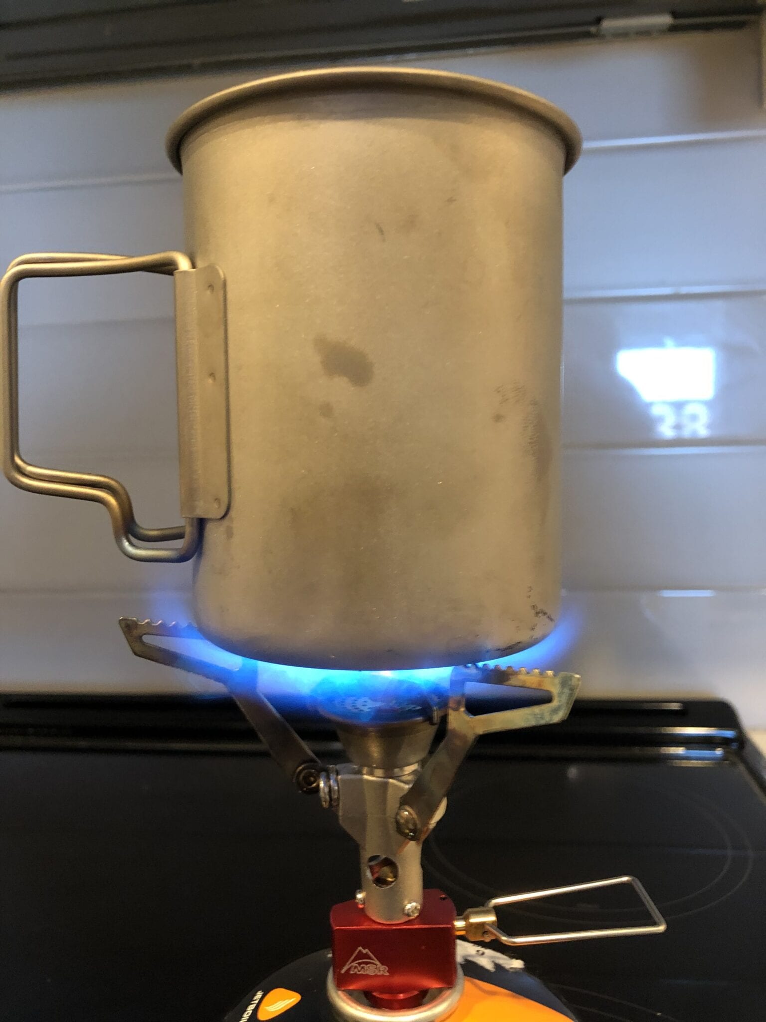backpacking stove boiling water in pot