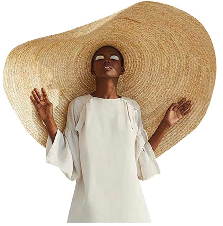 A woman wearing a big sun hat
