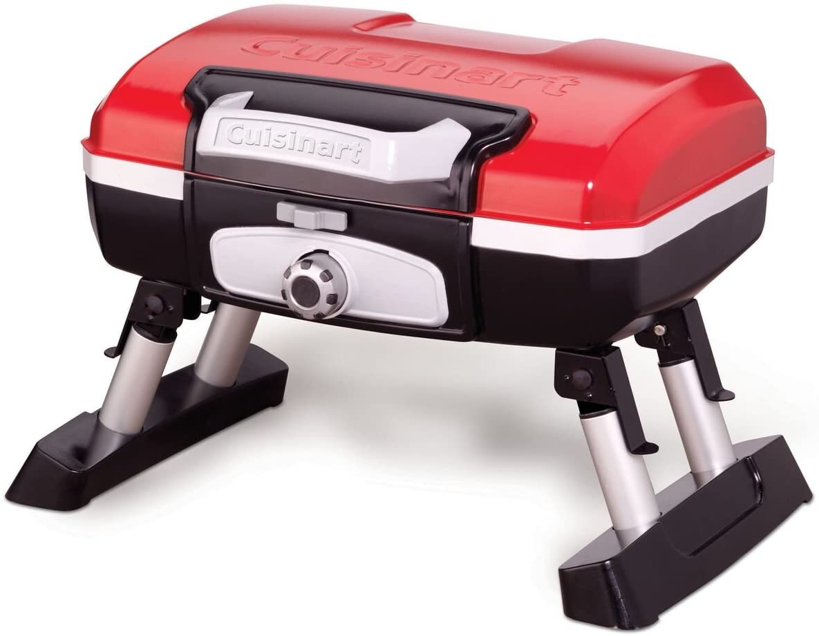 A portable red and black grill