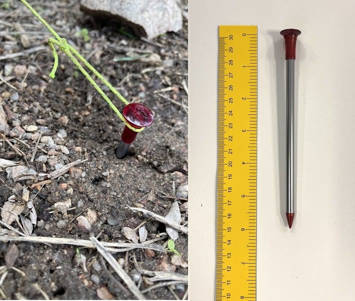 tent stake In the ground and the same tent stake being measured next to a ruler