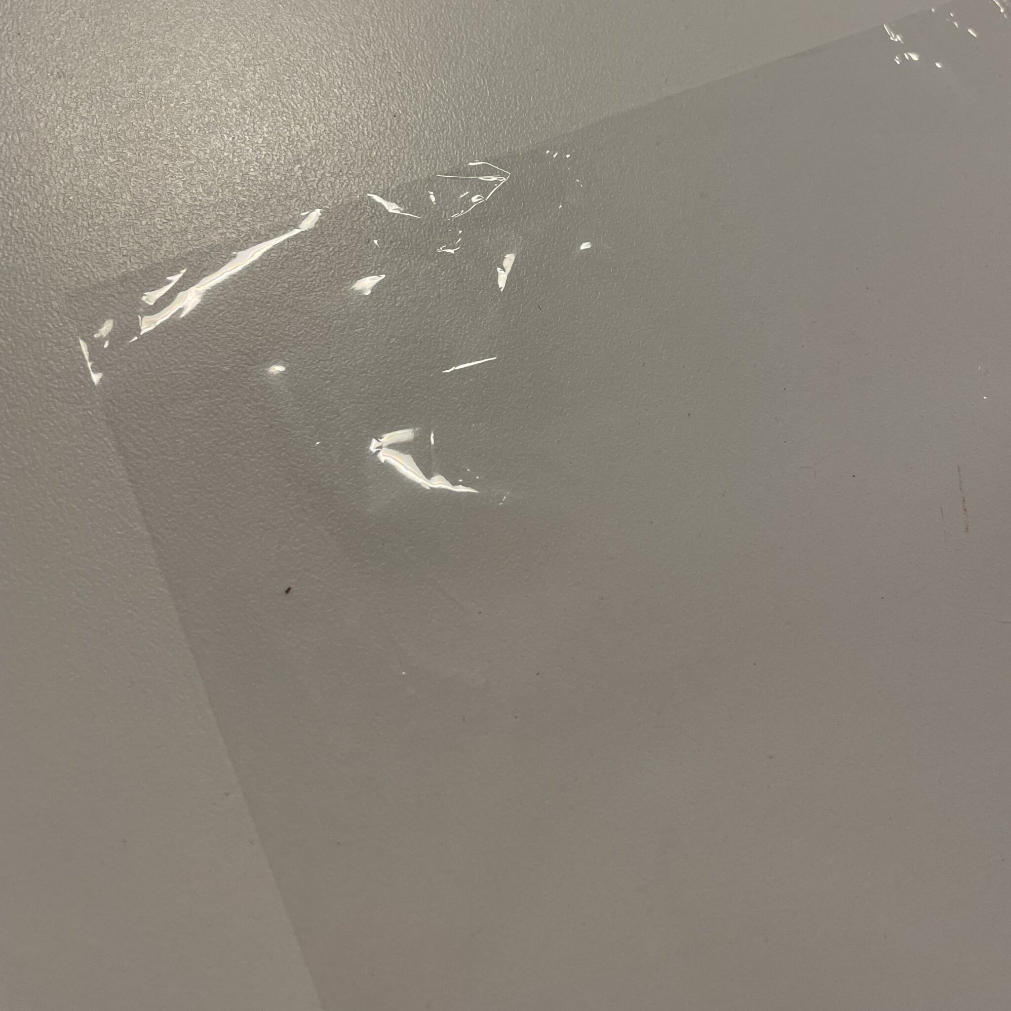 a thin sheet of transparent plastic
