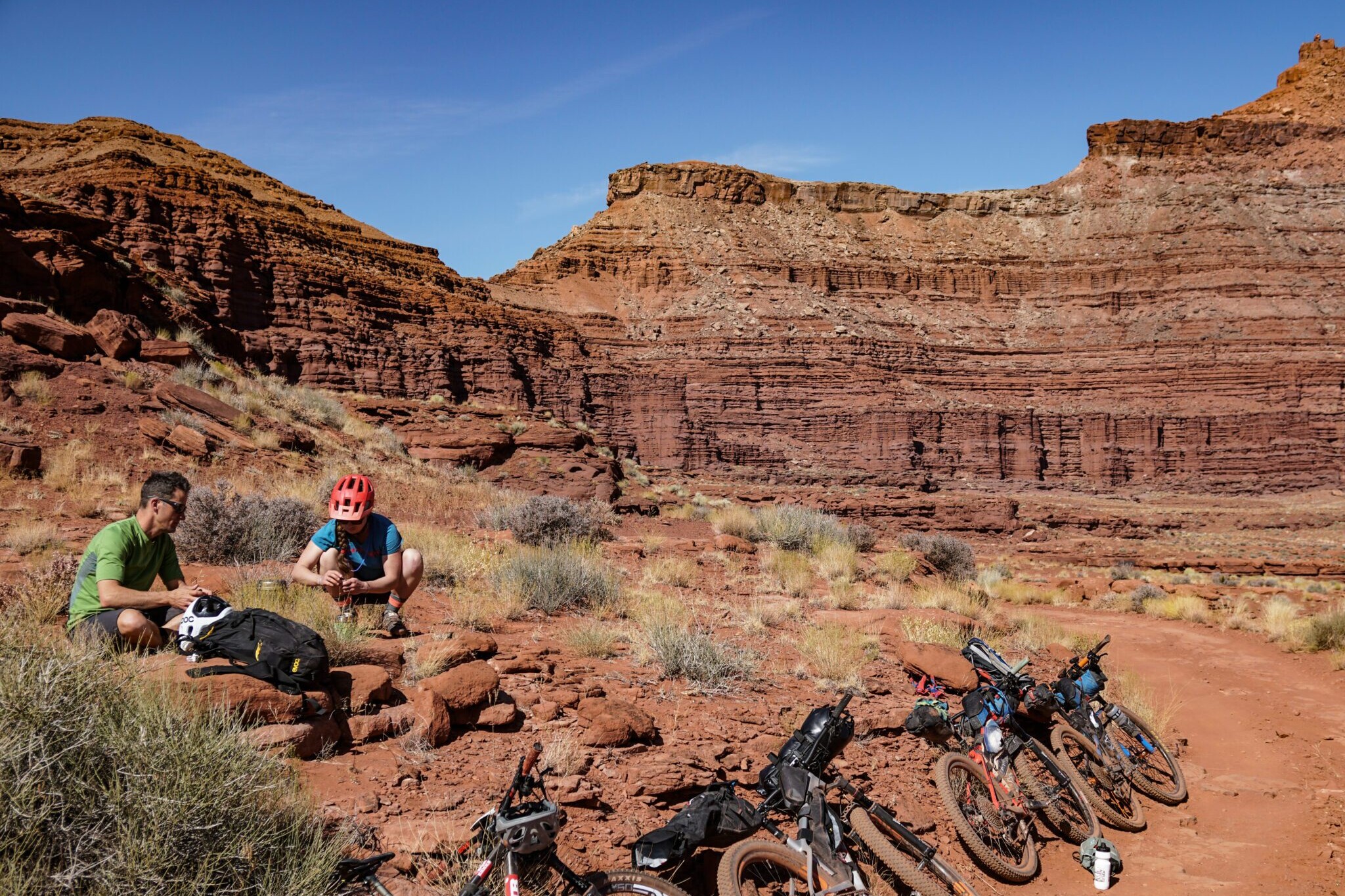 bikepackers stopping to take a break from the trail to make some food