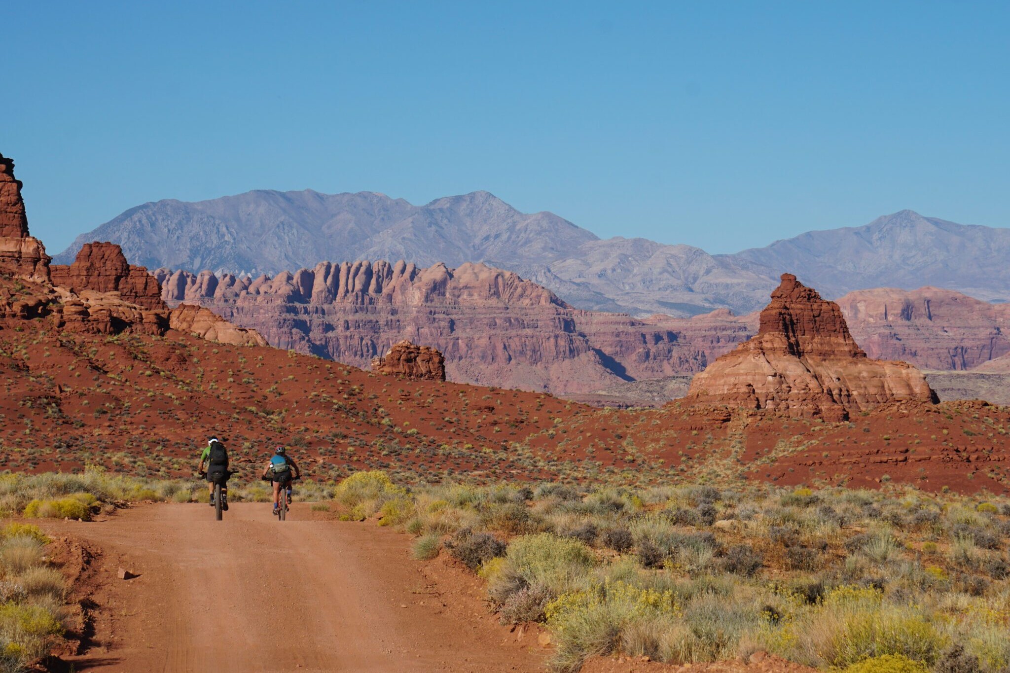 two bikepackers going off into the distance on the Bears Ears Loops trail