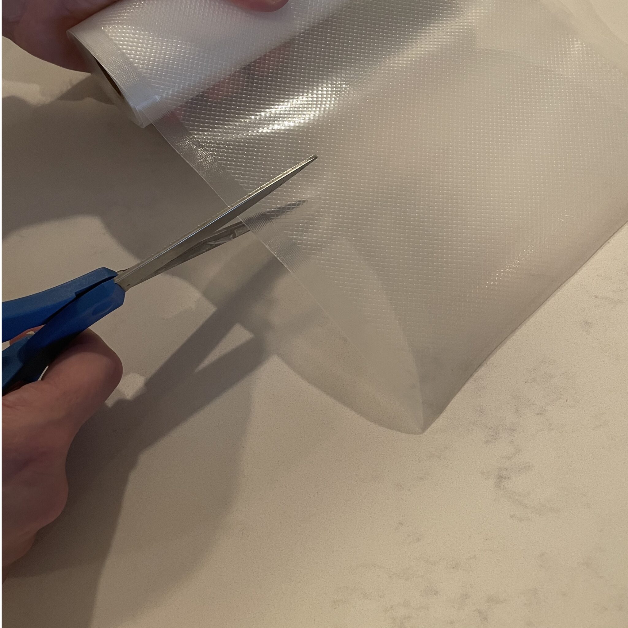 cutting the vacuum sealer plastic
